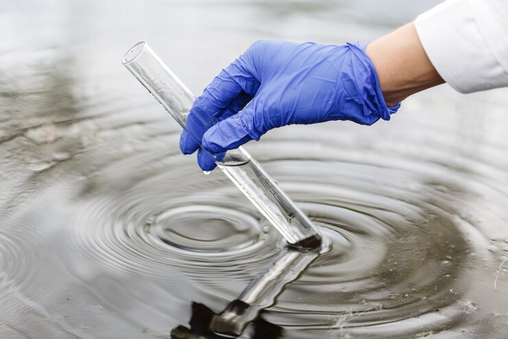 researcher holds test tube with water hand blue glove_8353 7164