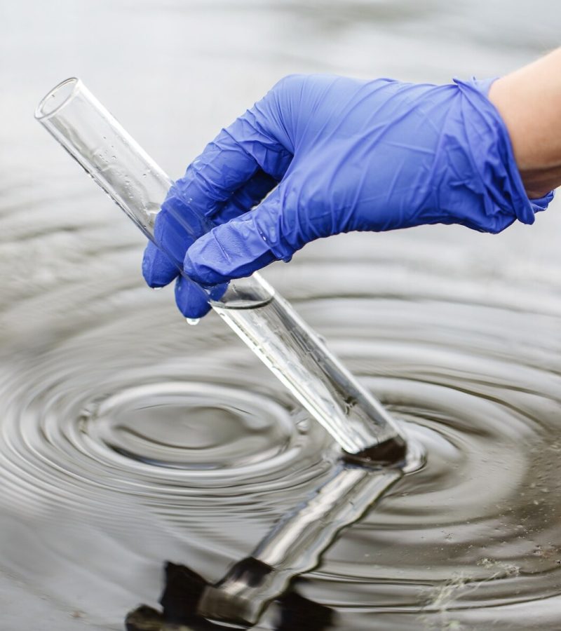 researcher-holds-test-tube-with-water-hand-blue-glove_8353-7164